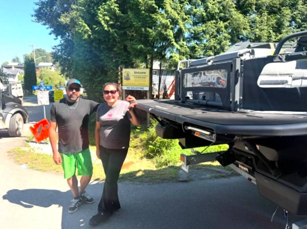 Customers with recreational vehicles on a trailer