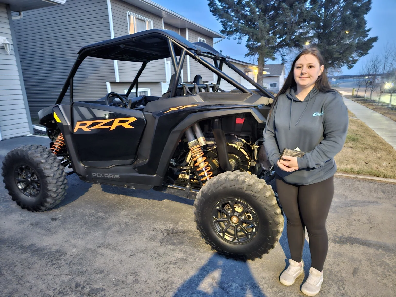 Customer beside a Polaris side-by-side