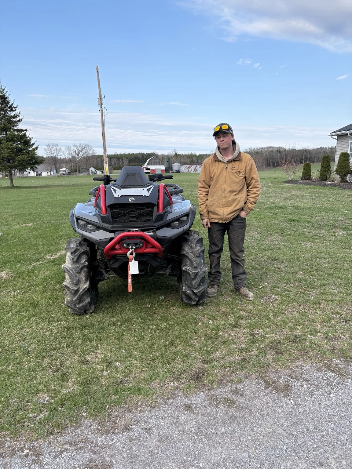 Customer with an ATV on a lawn