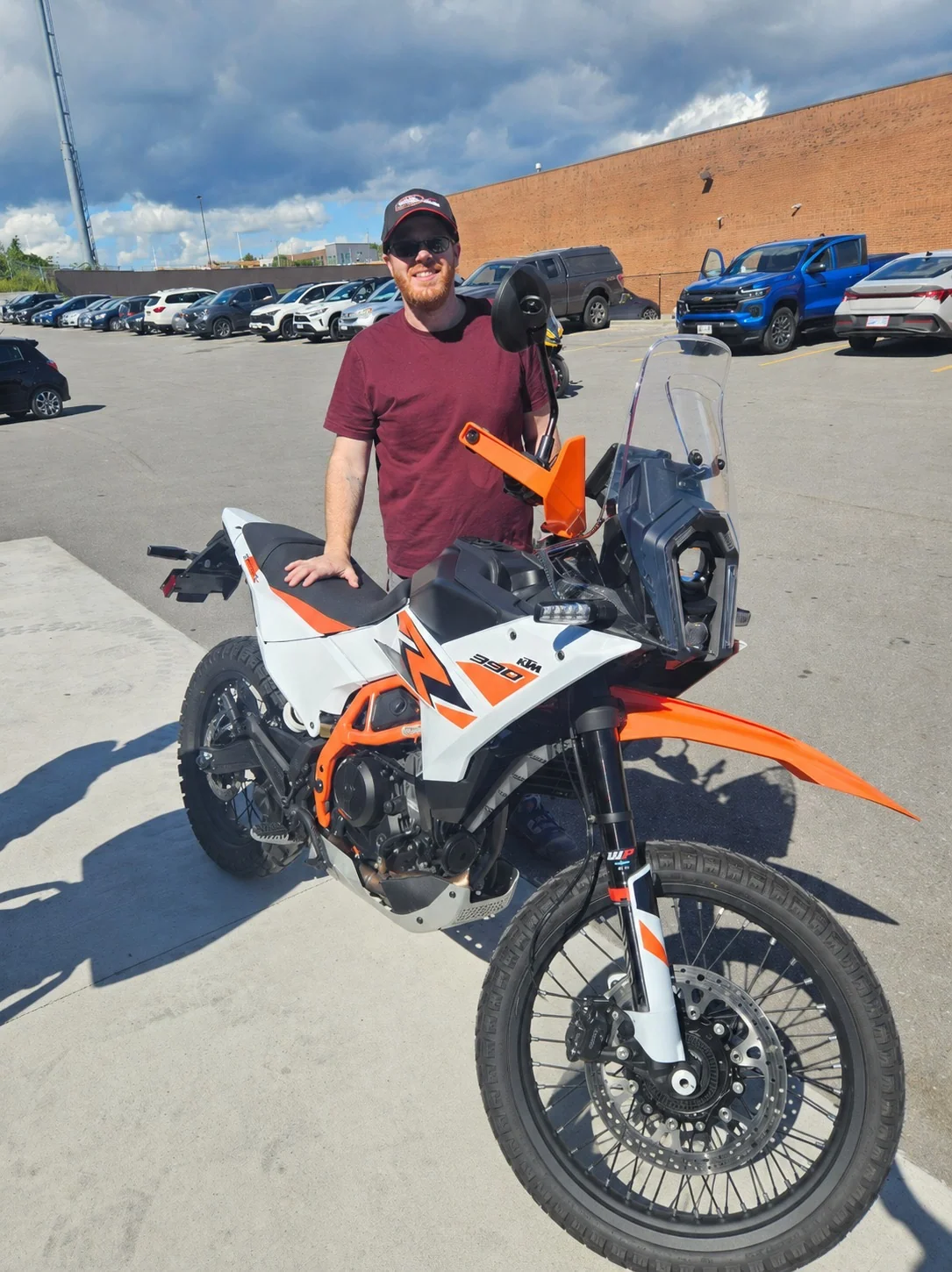 Customer beside a KTM motorcycle