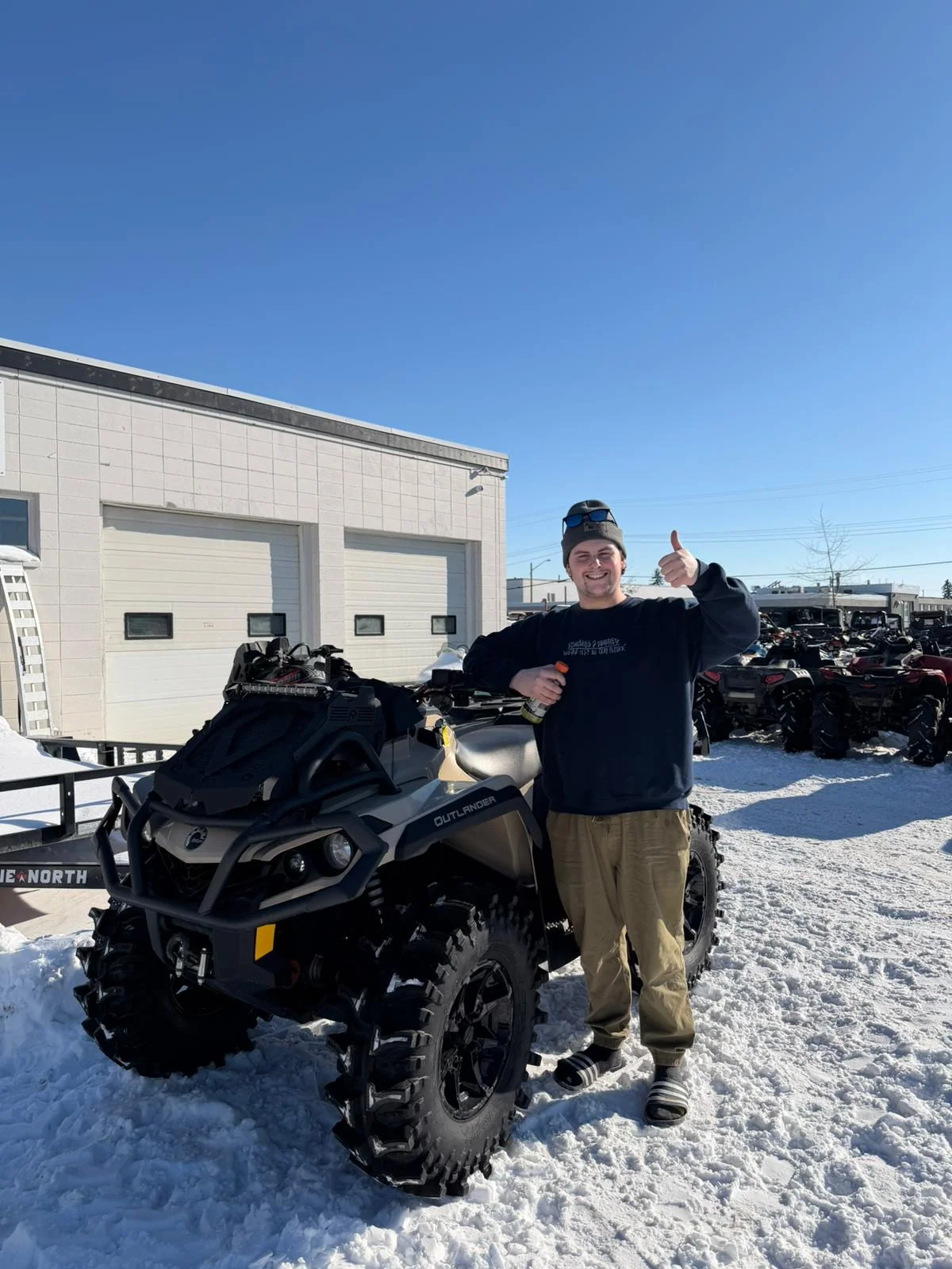 Customer with a Can-Am ATV in snow