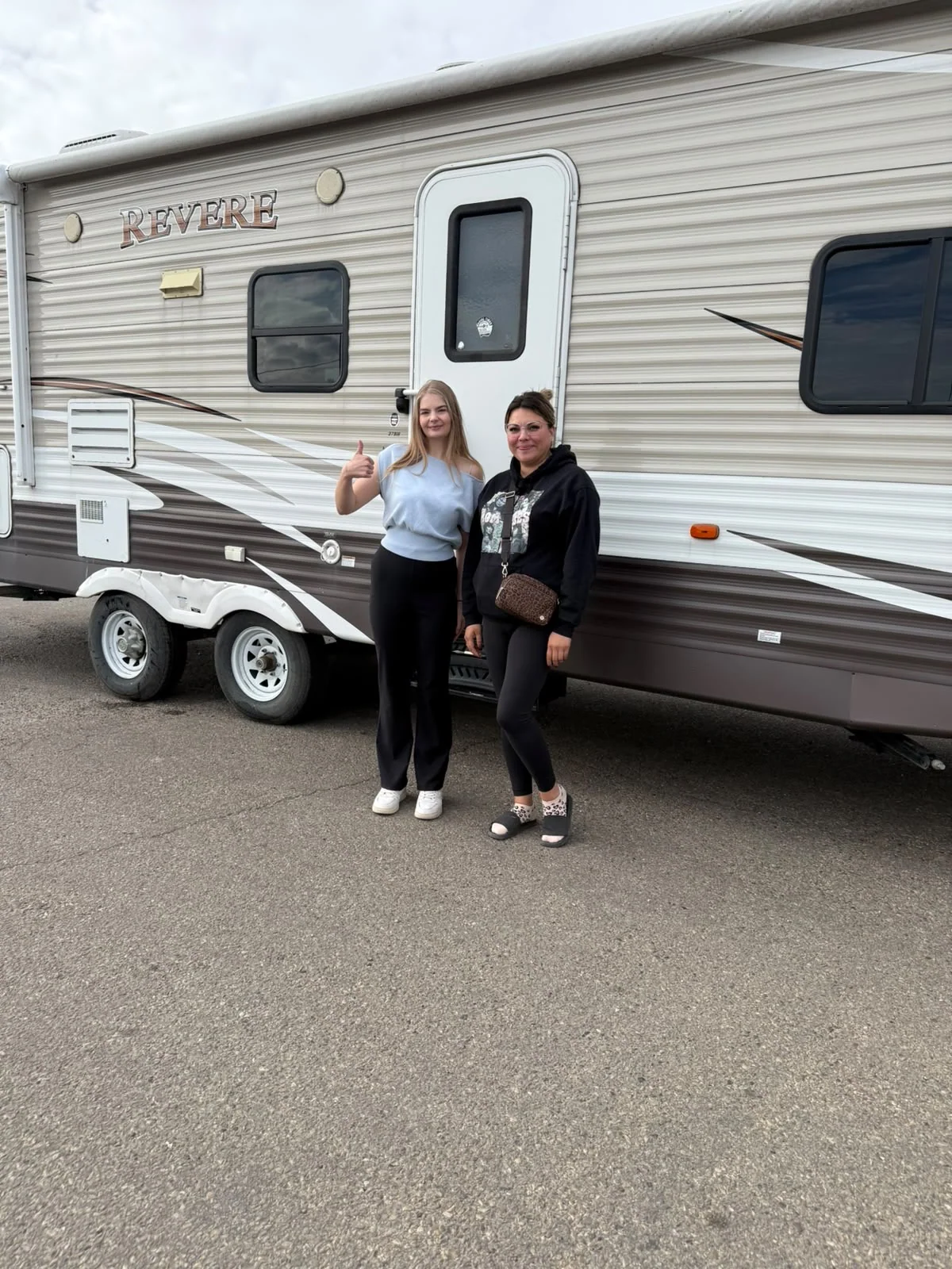 Customers beside a recreational trailer